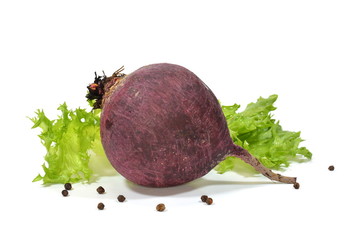 Whole beetroot, black pepper and green lettuce on white background