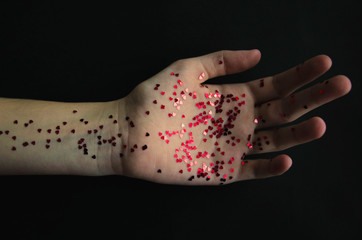 Bright black background on which the hands