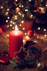 Candle and toys on Christmas eve. Holiday card for the New year