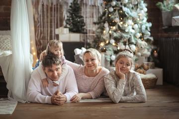 Obraz na płótnie Canvas happy family at Christmas tree,down syndrome
