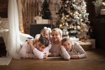 Obraz na płótnie Canvas happy family at Christmas tree,down syndrome
