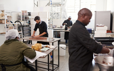 People working together in an artisanal chocolate making factory