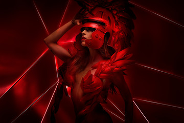 Red future, Roman warrior with helmet of feathers and horse mane. She is wearing a red dragon scales, fantasy pose