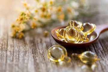 Healthy Vitamins on a Wooden Spoon.