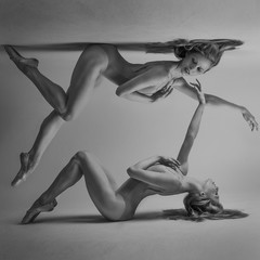 duality concept, classic ballet dancer lying down with elegant and delicate poses