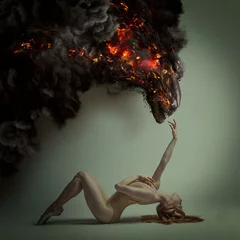 Fotobehang dualiteit en gevaar concept, klassieke balletdanser liggen met elegante en delicate poses en een vurig monster in dreigende pose, halloween © Fernando Cortés