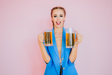Nice girl drinking a beer. Oktoberfest Beer fest. Young sexy and naked woman, serving big mugs