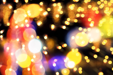 composite new yer background. abstract christmas tree with lights. defocused image with zoom...