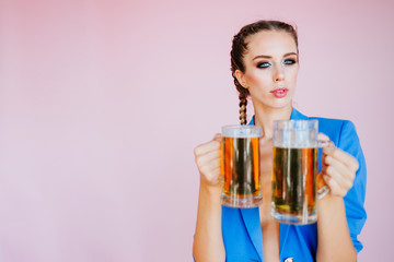 Nice girl drinking a beer. Oktoberfest Beer fest. Young sexy and naked woman, serving big mugs