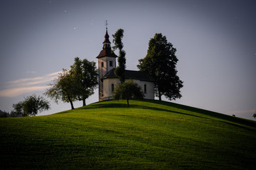 Sv.Tomaz church above Skofja Loka in the night