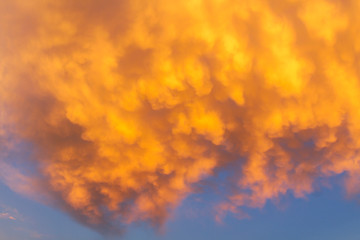 Abstract colorful orange sunset with cloudy sky and dramatic light background