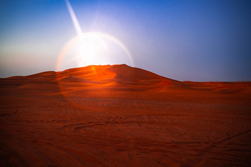 Fototapeta na wymiar Desert at sunset. Sand dune in the desert.