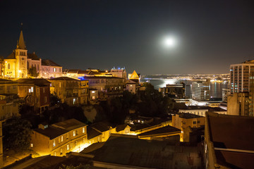 Historic harbor Valparaiso, Chile by night with full moon