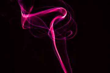 Creative Abstract Pink Smoke Pattern on Black Background