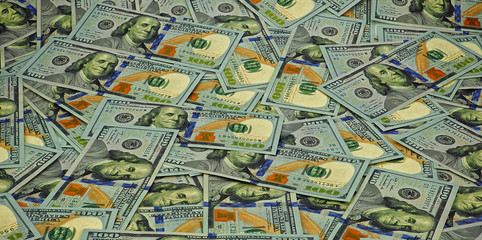 Lot of one hundred dollar bills close-up background