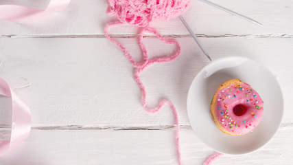Donut on a white plate, copy space