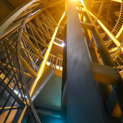 Night-time recording of the illuminated spiral staircase leading from the platform of an...