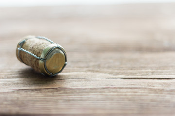 champagne cork on wooden background