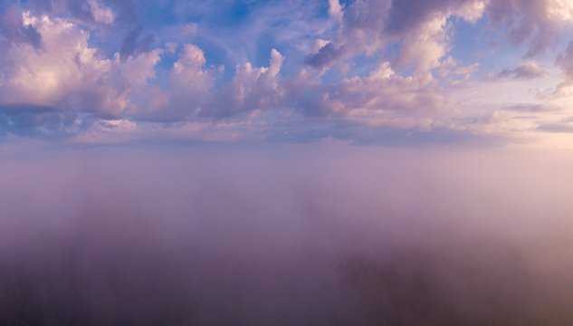 Beautiful foggy sunrise landscape from drone. © milosz_g