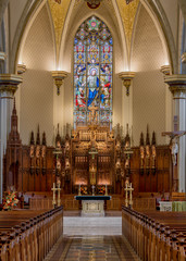 Fototapeta na wymiar Altar and sanctuary inside the Cathedral of the Immaculate Conception in Fort Wayne, Indiana