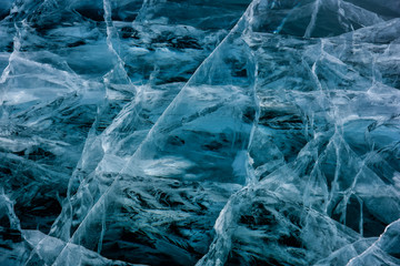 Blue cracked surface of the ice surface