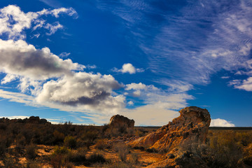landscape with a blue sky and interesting rock formations