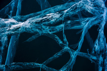 Blue cracked surface of the ice surface