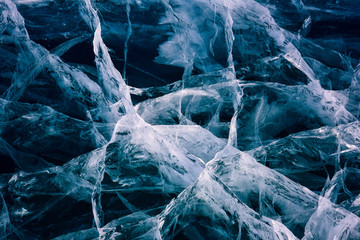 Blue cracked surface of the ice surface