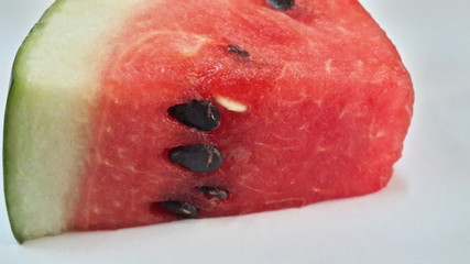 Watermelon sliced into slices in a plate.
