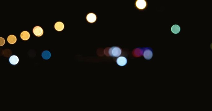 night street with sparce traffic lights moving