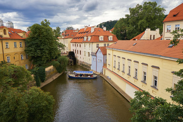 Fototapeta na wymiar Vltava river water canal in Prague with boat European Czech republic tourist travel historical and cultural landmark