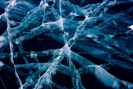 Blue cracked surface of the ice surface