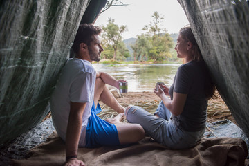 couple spending time together in straw tent