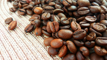 Roasted brown coffee beans on cloth background