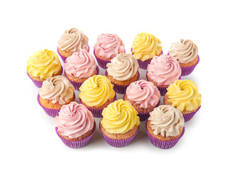 Delicious cupcakes on white background