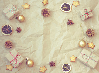 Obraz na płótnie Canvas Christmas vintage background, gift box, golden balls, anise, dried orange, cookie star shape