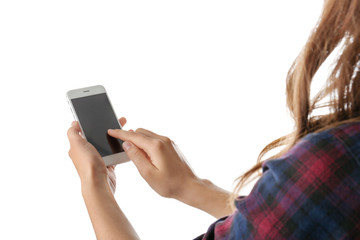 Young woman holding mobile phone on white background