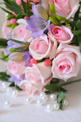 bridal bouquet of fresh roses on the table. wedding floristry, floristic decorative statement