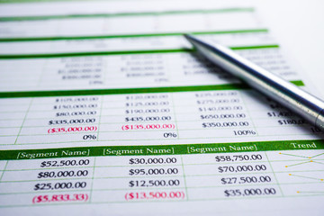 Obraz premium Spreadsheet table paper with pencil. Finance development, Banking Account, Statistics Investment Analytic research data economy, trading, Mobile office reporting Business company meeting concept.