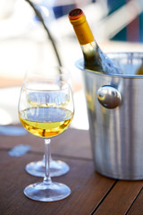 Pair of wineglasses against the yacht