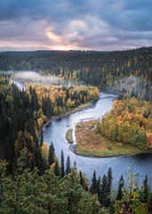 Scenic river landscape with fall colors woodland at autumn morning in National Park, Finland