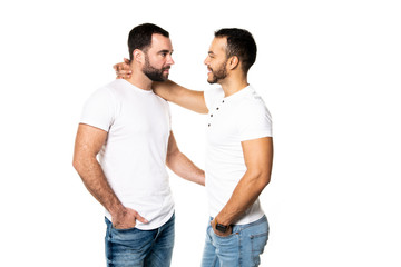 Young homosexuals gay couple love each other on a white background.