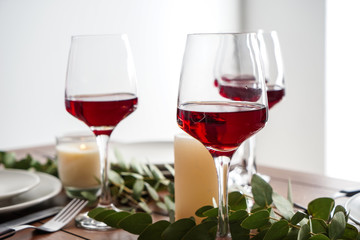 Glasses of wine on table set in restaurant