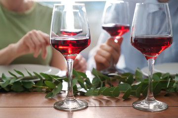 Glasses of red wine on table set for party