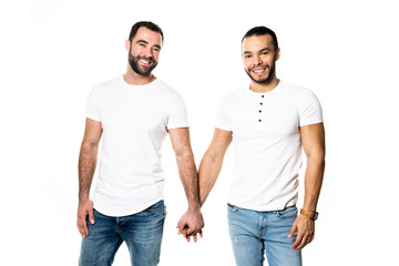 Fototapeta premium Young homosexuals gay couple love each other on a white background.