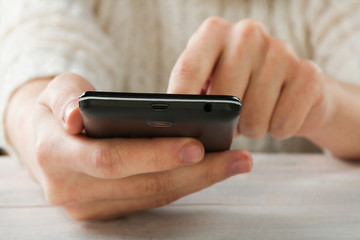 Black smartphone in hand