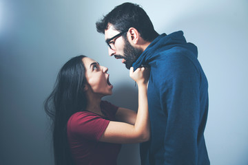 young angry couple in home