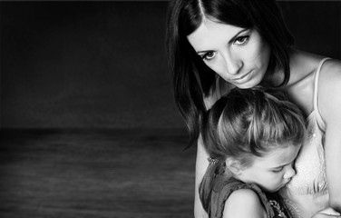 Portrait  of sad Mother with daughter