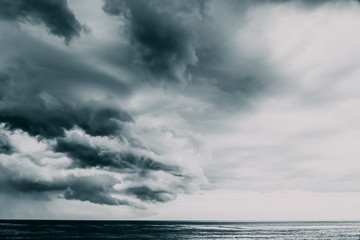 Storm Clouds Gathering Over Ocean - obrazy, fototapety, plakaty