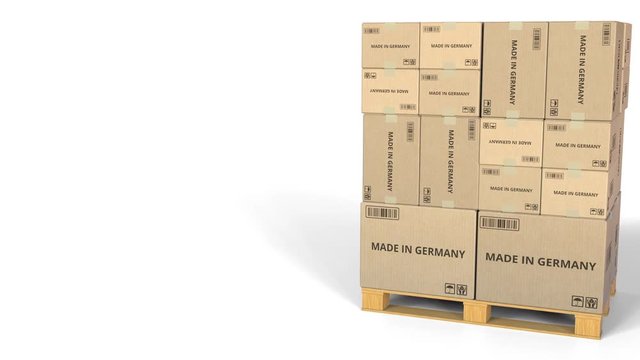 MADE IN GERMANY text on boxes on a pallet. Conceptual 3D animation